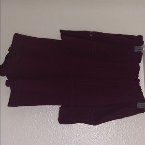 A maroon like colored romper